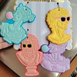 Wandering Moon Luggage Tags Sculptures With Bubble Gum And Glasses